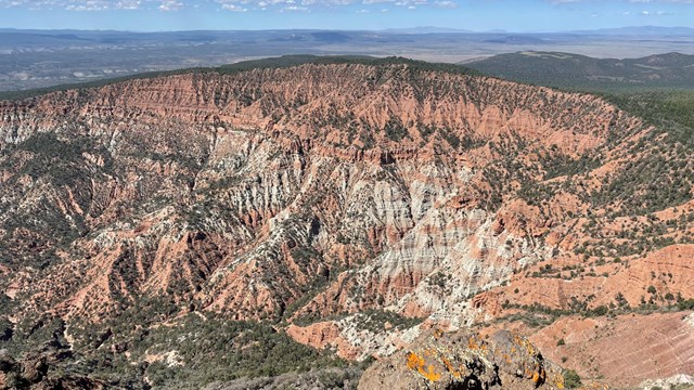 Hells Hole in the Mount Logan Wilderness showing red and white layers of the Moenkopi Formation.