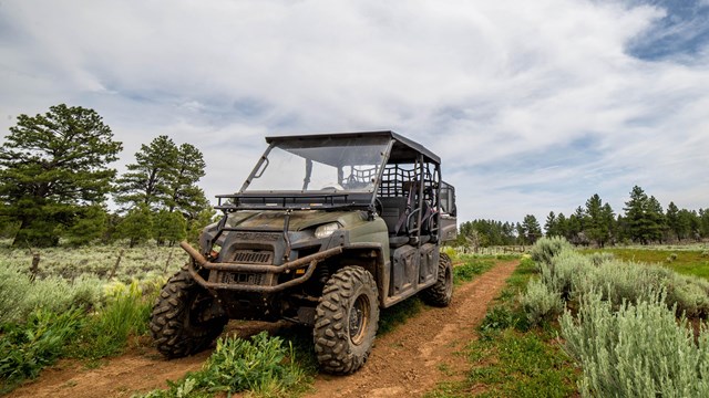 View of an UHV on a dirt road.