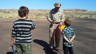 Volunteer John is out flying kites with kids