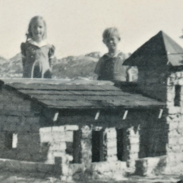 Children with toy building