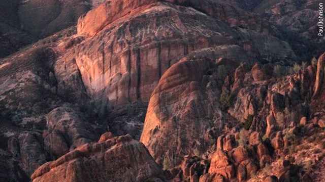 Sunset lighting on dramatic rock formations of balconies cliffs at Pinnacles.