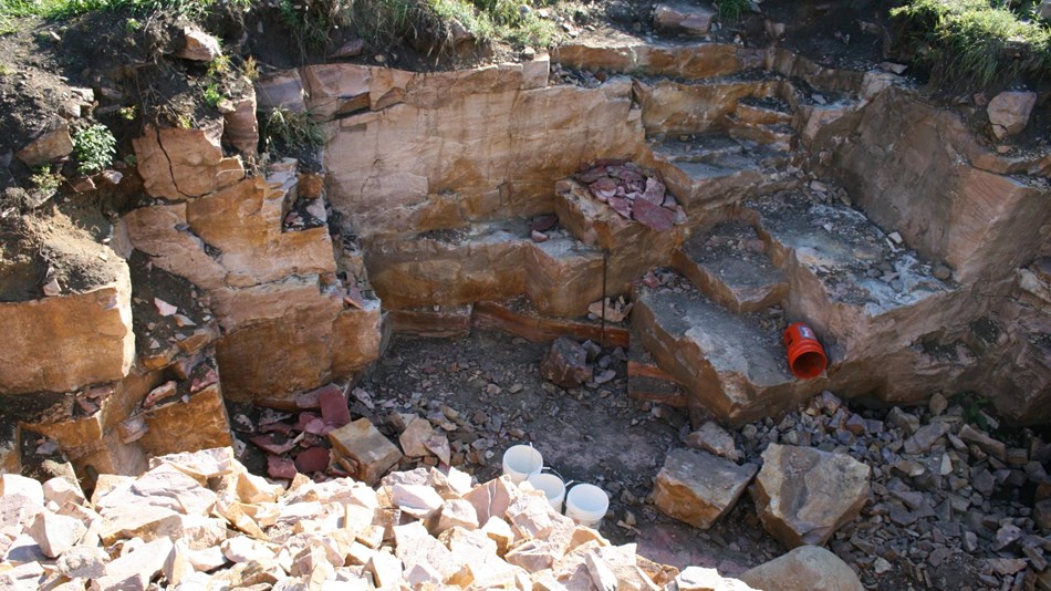 Pipestone quarry showing tools, quartzite rubble, and depth of quarry.