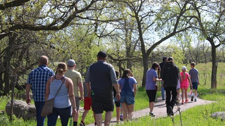 A group of people walking along a trail