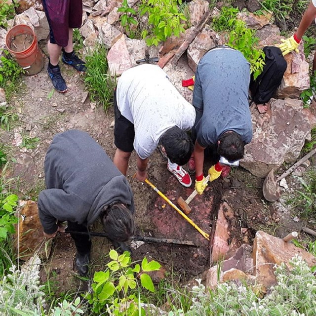 A group of men working in a quarry pit
