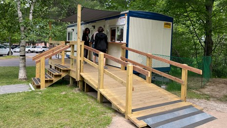 Visitors getting information from staff at the trailer.