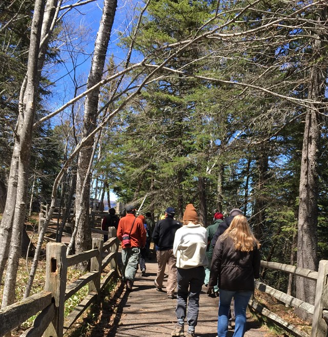 People walking on a paved trail