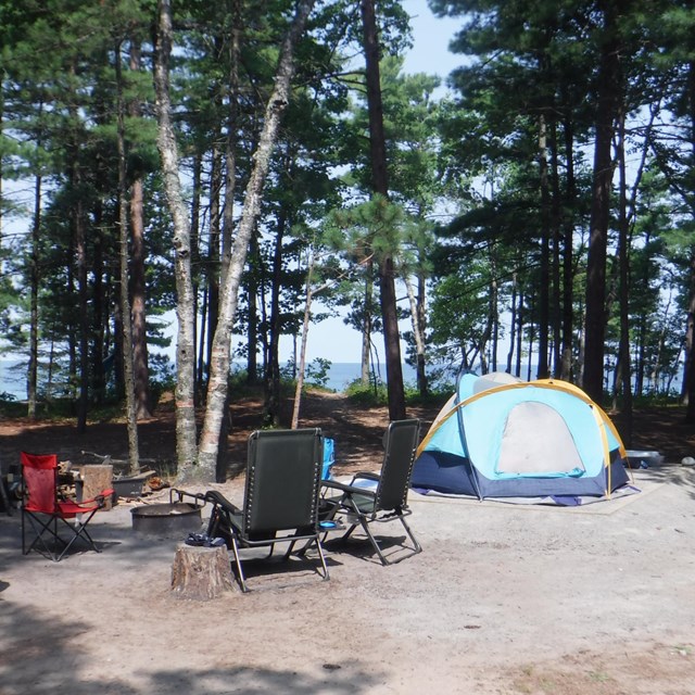 Campsite set up with view of lake in background