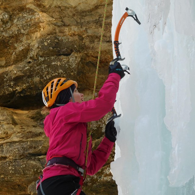 Ice climber on ice column