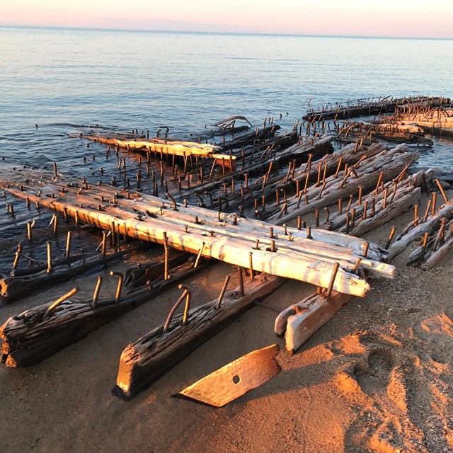Wooden shipwreck pieces on the beach