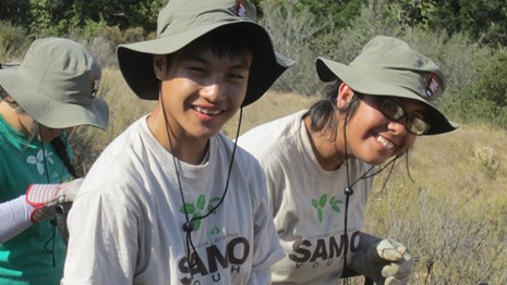 Two student volunteers posting for the camera