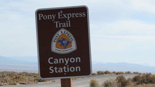 A brown road sign indicating the presence of the Pony Express.