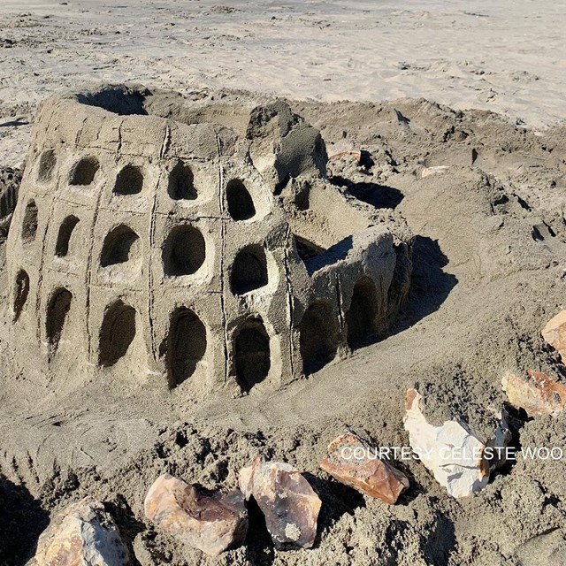 A small sand sculpture of the Rome, Italy, Coliseum.