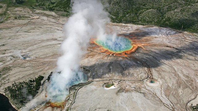 Aerial view of rainbow colored hot springs.