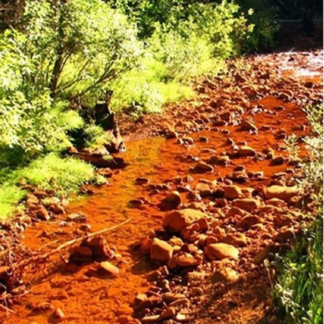 Three stages of restoration of Soda Butte Creek. From orange-colored iron contamination to pristine
