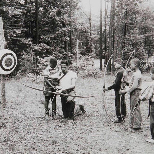 Campers learning archery 
