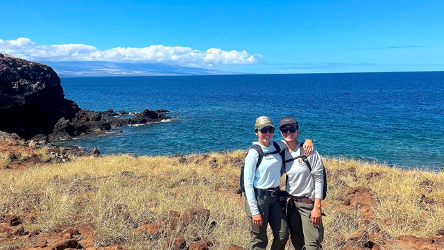 Pair of interns on seaside trail