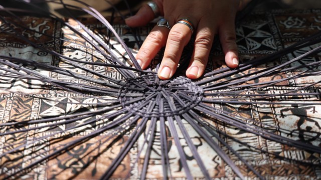 Closeup of hand doing weaving