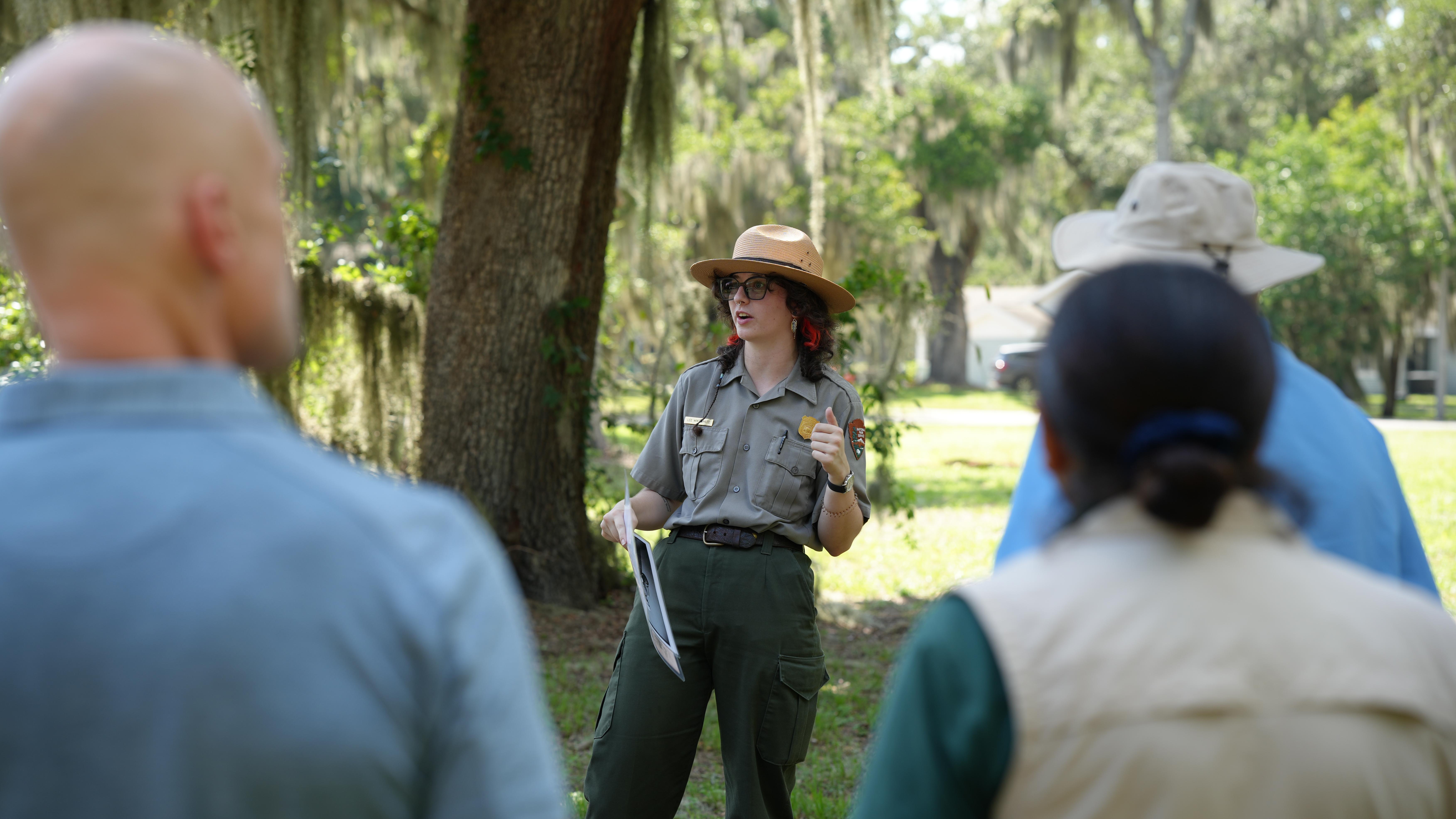 A ranger talking to a tour group.