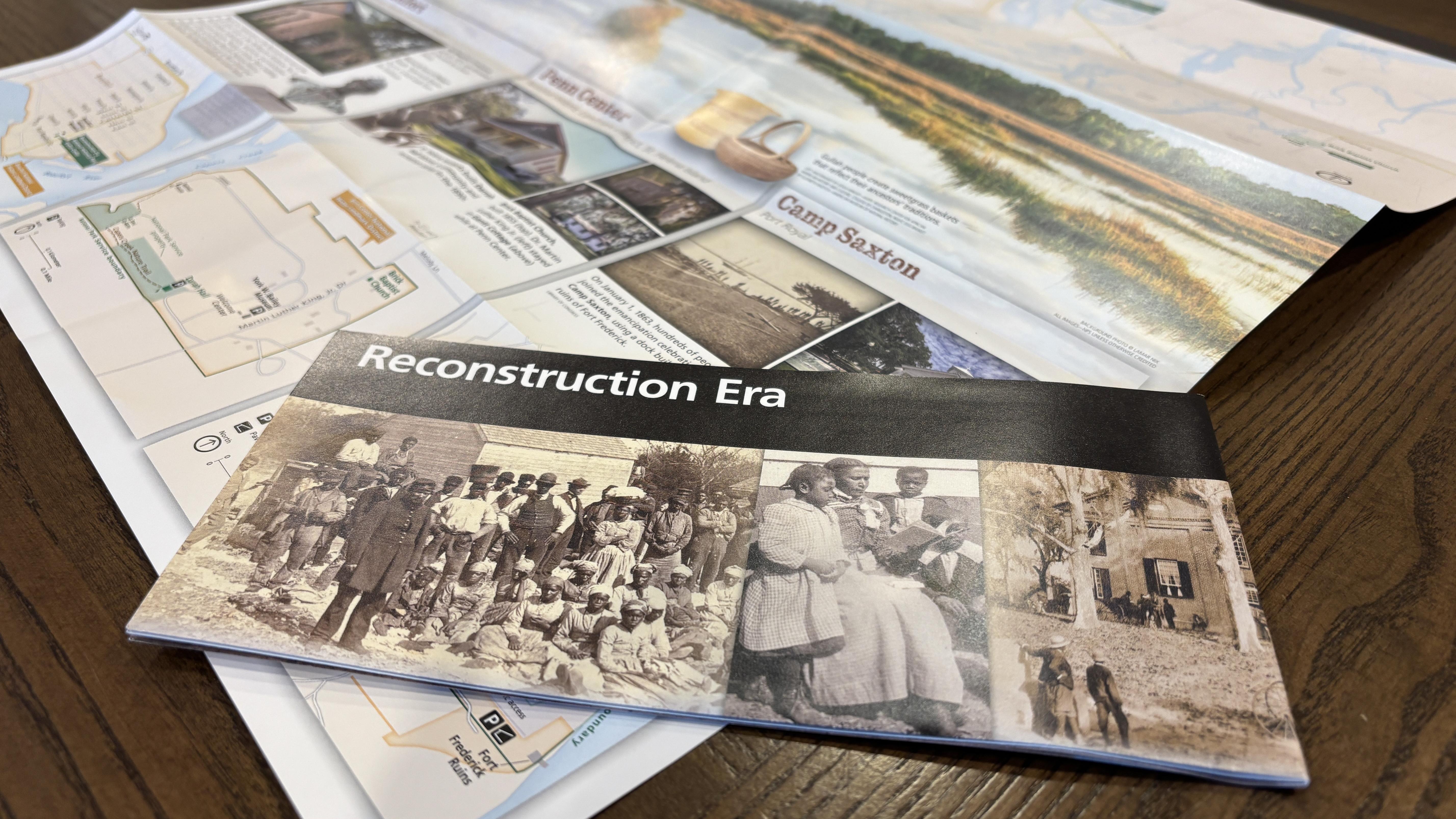 A brochure for Reconstruction Era Historical Park with park information on a table.