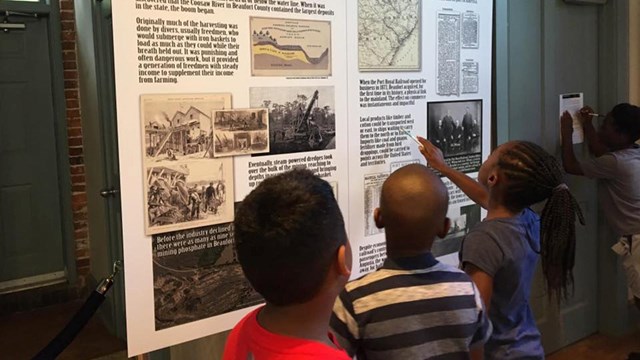 Kids looking at an exhibit