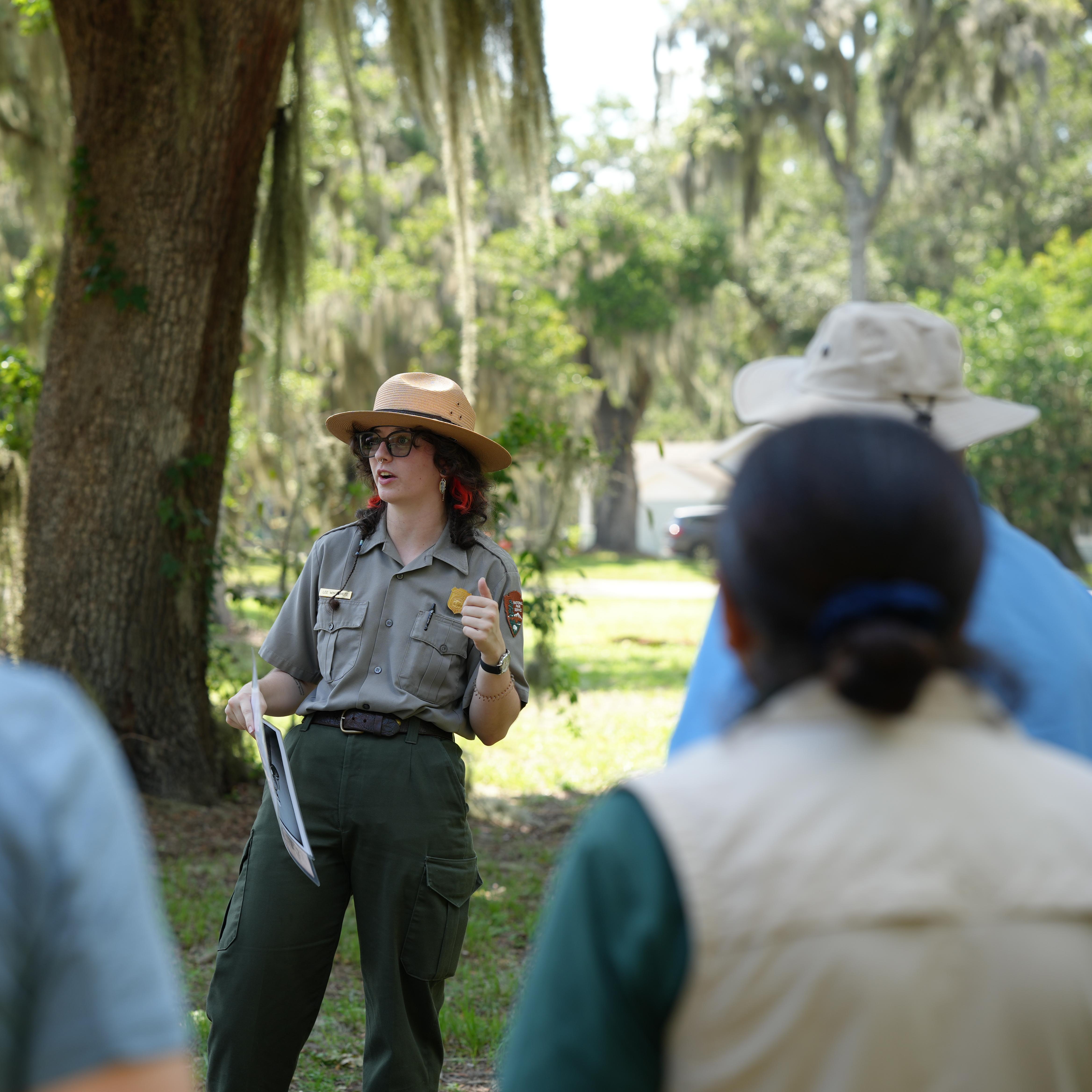 A ranger talking to a tour group.