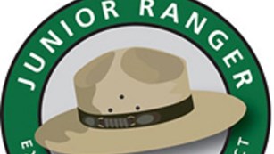 A digital image of a park ranger hat under a banner reading, "Junior Ranger."