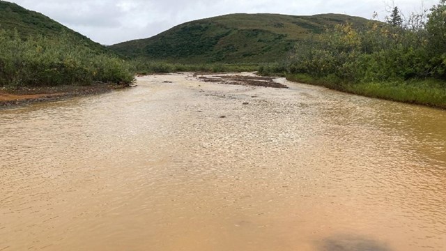 a river with orange rusty water