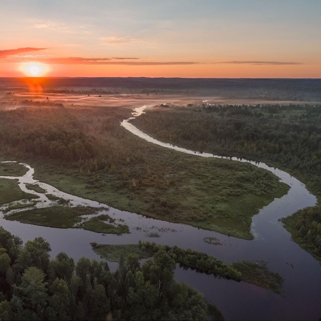 Braided stream flowing across the landscape at sunset. Credit: Craig Blacklock