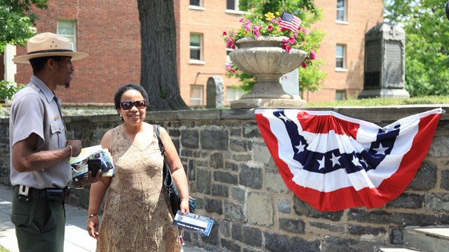 a park ranger talks to a visitor during a special event