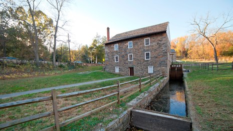Peirce Mill from behind, the water wheel trough leads up to the building. 