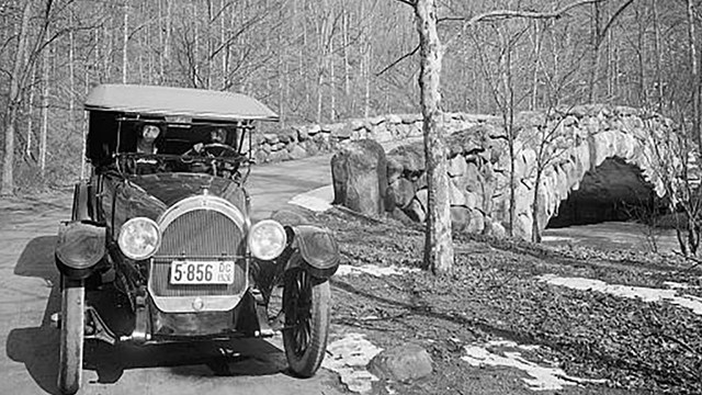 black and white image of an old automobile at Boulder Bridge