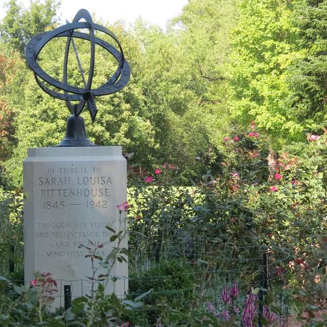 An armillary sphere surrounded by greenery
