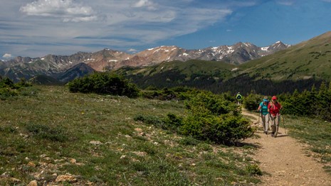 People are hiking in the Rockies