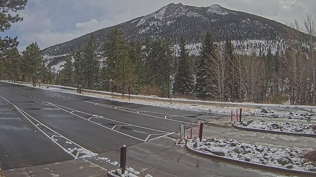 Snow is melting on the pavement following a winter storm near Fall River Entrance