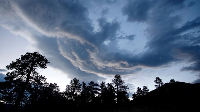 Weather changes quickly - a view of storm clouds rolling in over the mountains