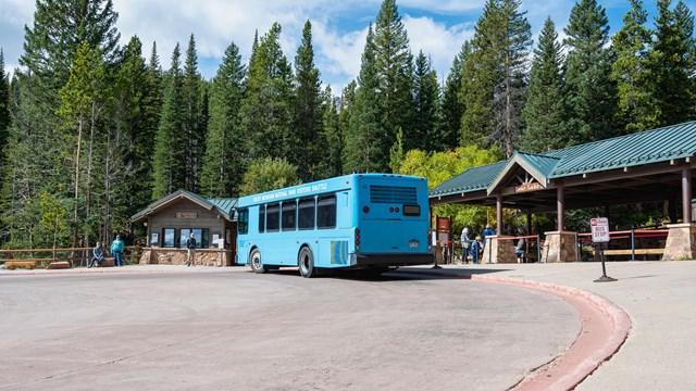 A shuttle bus is picking up passengers at Bear Lake