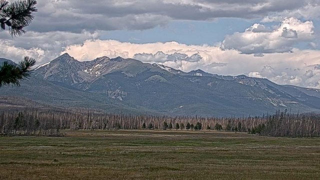 View of the Never Summer Mountains in July as seen in a webcam