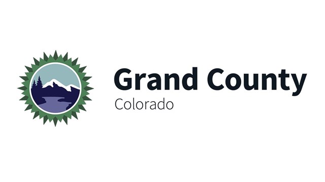 The Grand County Logo with a mountain in scene. 