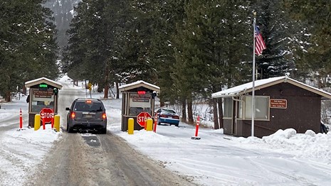 Park entrance station with the American Flag flying in the background