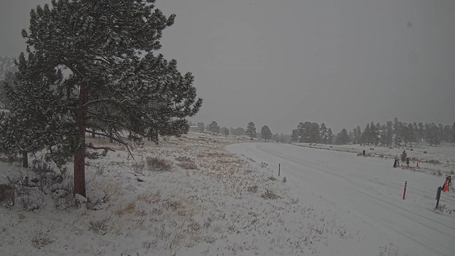 Beaver Meadows Entrance with snow on the ground covering the road