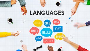 A graphic image of multiracial hands pointing to the word "Hello" in different languages.