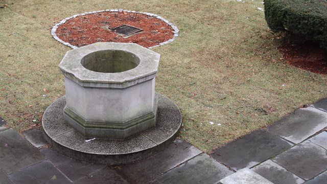 View of the stone well and garden