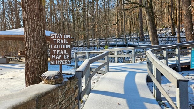Boardwalk covered in snow.