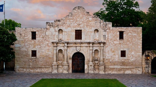 the alamo with a sunset background