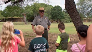 Park Ranger guides children at Mission San Jose