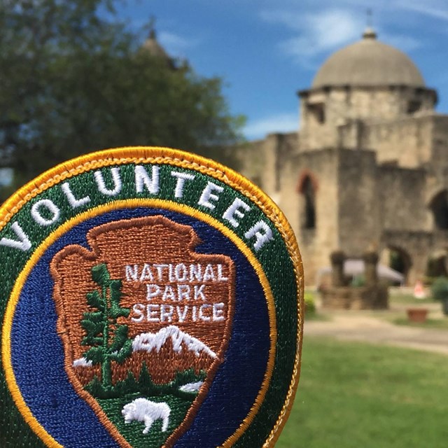 Volunteers staff the mission sites and interpret history to the public.