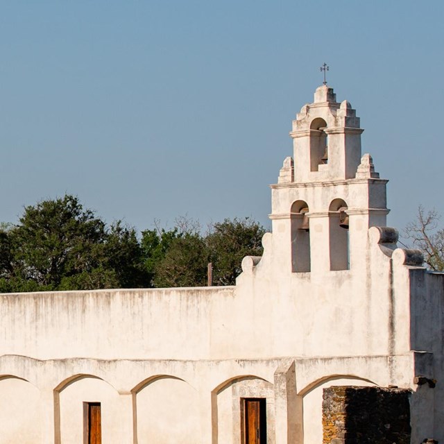 white plastered church in a field