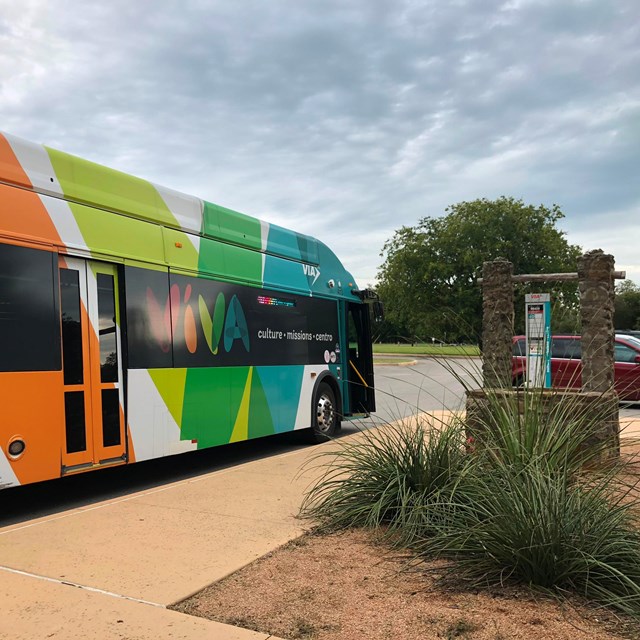 VIVA bus stopped outside of the Mission San Juan complex