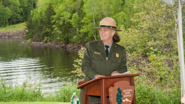 A ranger in front of a podium