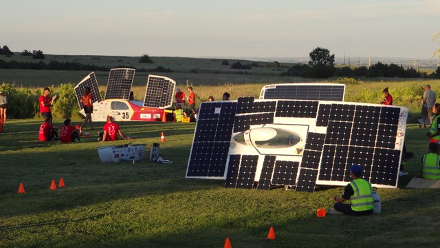 Solar cars on a racetrack.